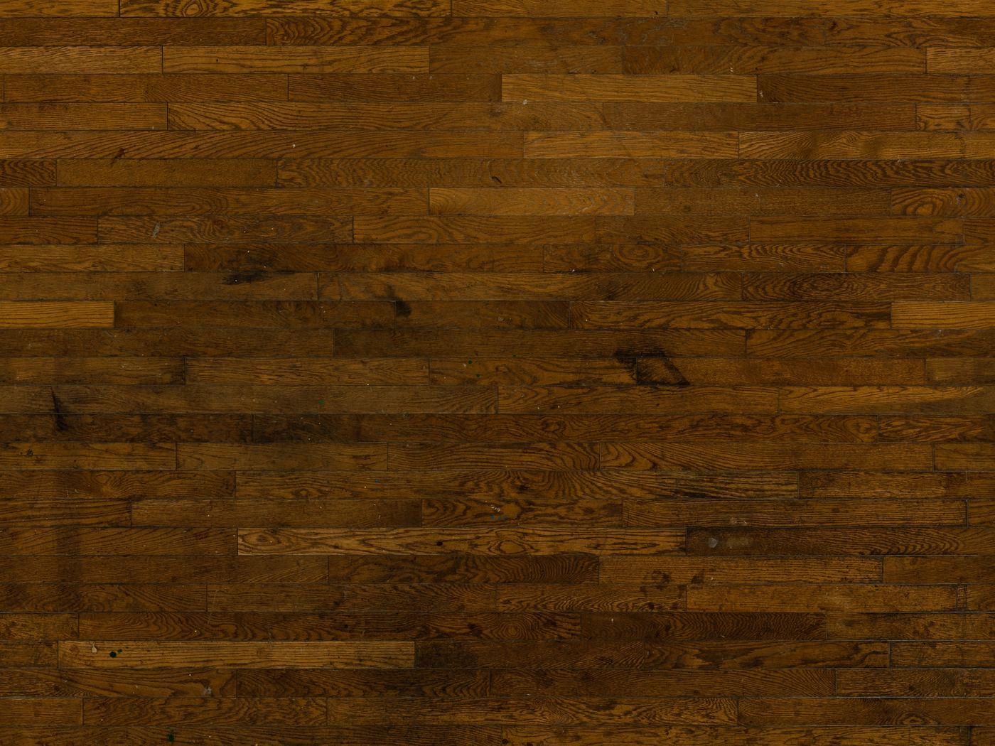 Close up of old dark hardwood floorboards
